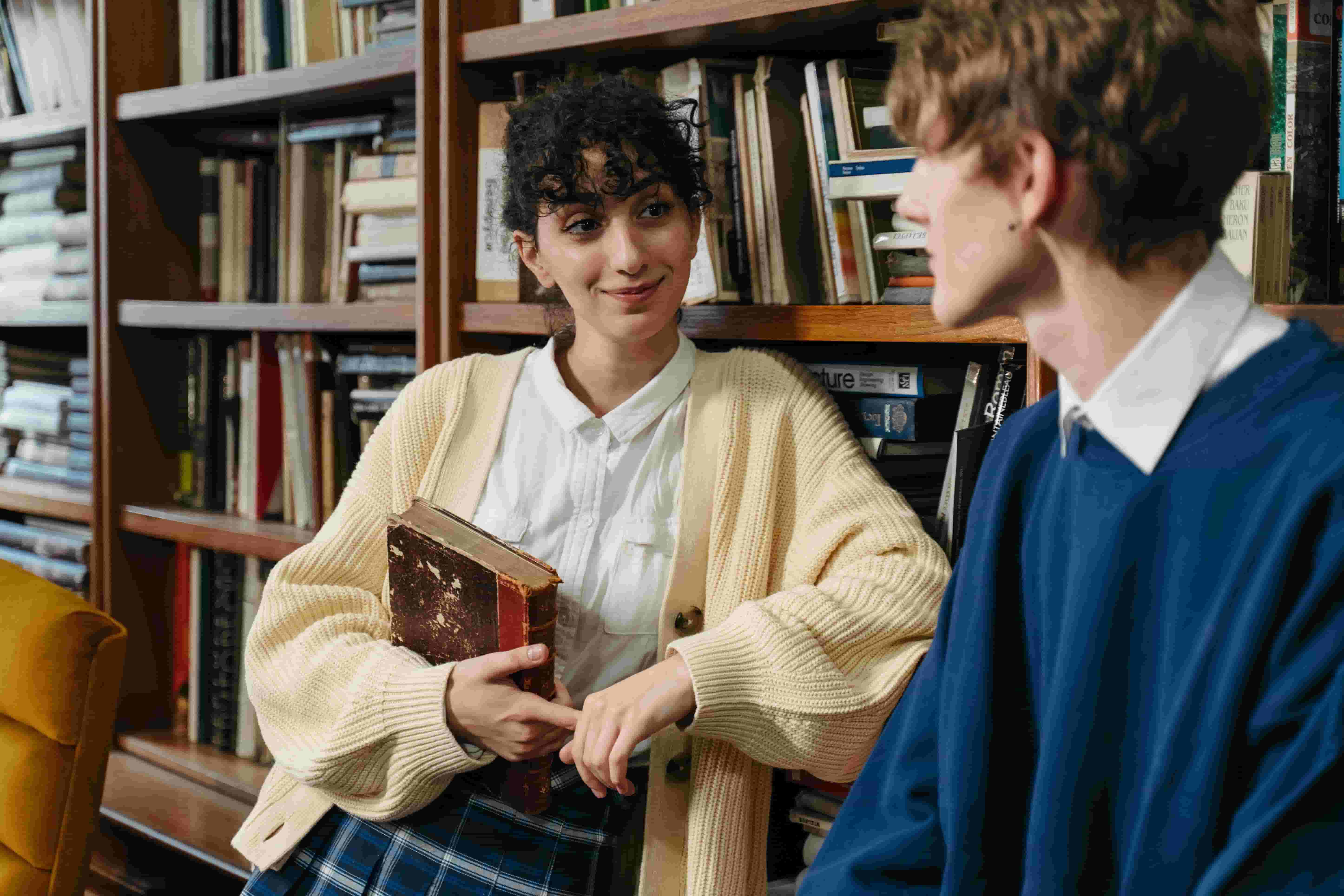 people talking in a library