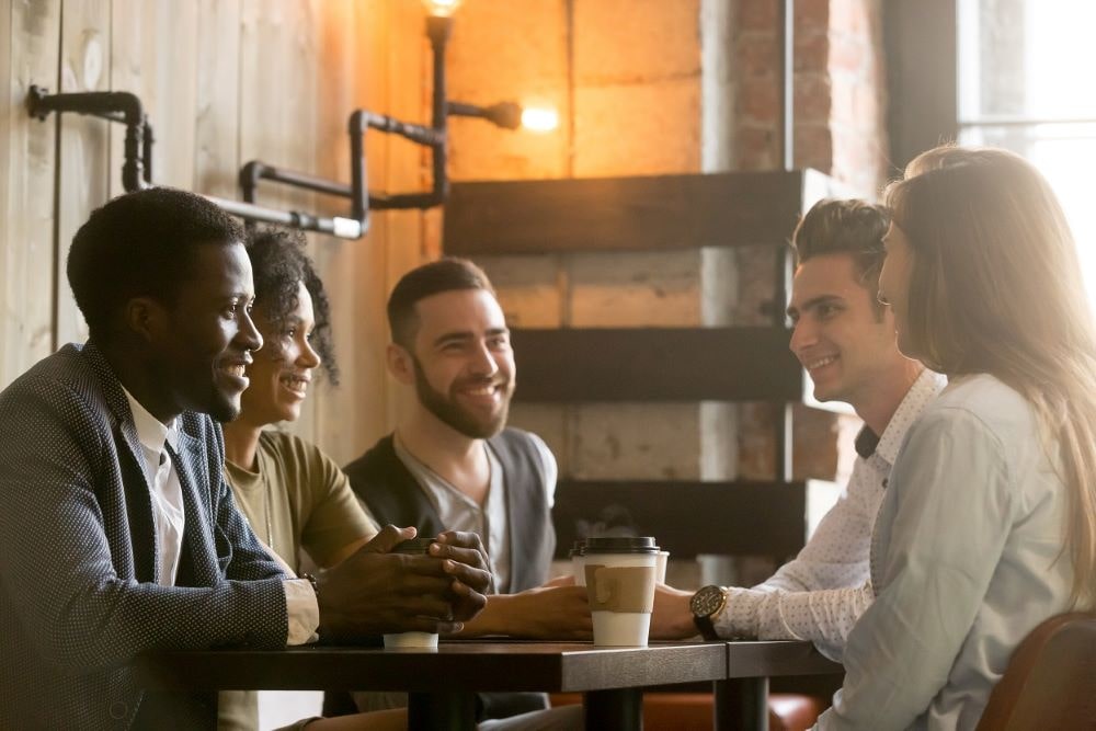 Group of people around a table having a meeting 